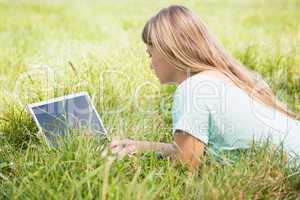 Woman using laptop in park