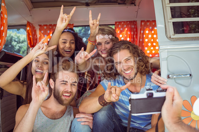 Hipster friends in a camper van