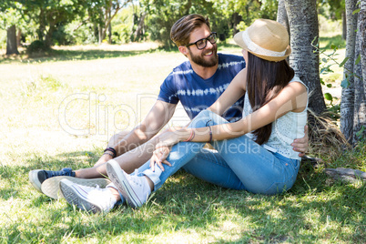 Hipster couple relaxing in the park