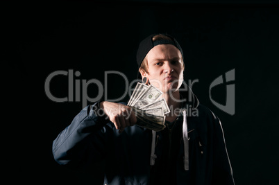 young man with money in his hands