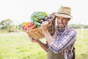 Farmer carrying basket of veg