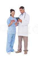 Doctor and nurse using a tablet