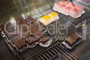 Display case with cheesecakes and brownies