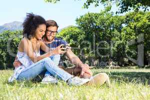 Hipster couple relaxing in the park