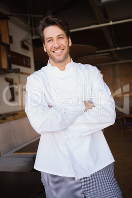 Smiling baker standing with arms crossed Smiling baker standing with arms crossed