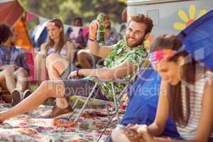 Carefree hipster relaxing on campsite