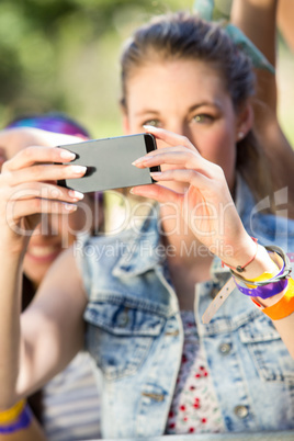 Excited music fan taking photo