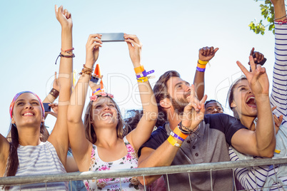 Excited music fans up the front