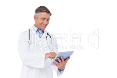 Happy doctor using tablet pc