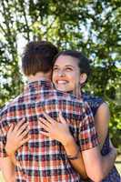 Cute couple hugging in the park