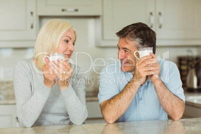 Happy mature couple having coffee together