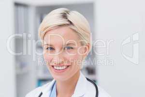 Confident doctor smiling in clinic