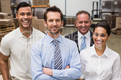 Warehouse team smiling at camera