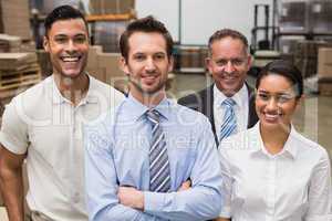 Warehouse team smiling at camera