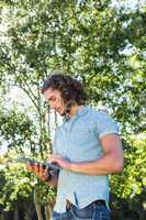 Young man using tablet in the park