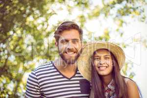 Hipster couple smiling at camera