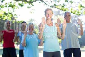 Happy athletic group showing their hands