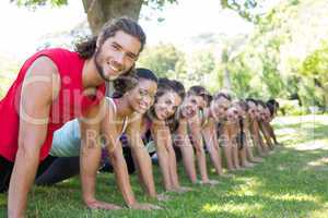 Fitness group planking in park