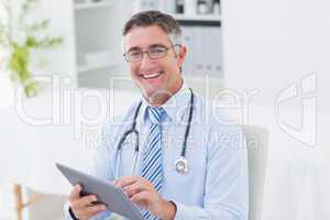 Portrait of doctor using tablet computer