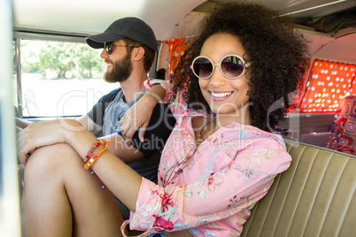 Hipster couple driving in camper van