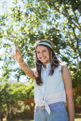 Pretty brunette using her inhaler