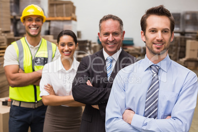 Warehouse team smiling at camera