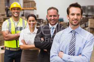 Warehouse team smiling at camera