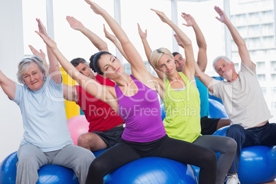 People exercising in gym class