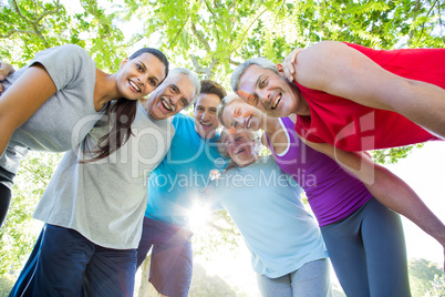 Happy athletic group looking down at the camera