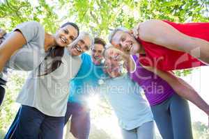 Happy athletic group looking down at the camera