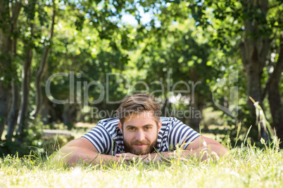 Hipster lying on the grass in the park