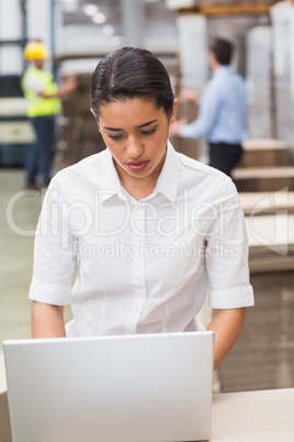 Focused manager using her laptop