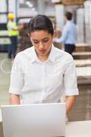 Focused manager using her laptop