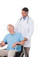 Doctor pushing senior patient in wheelchair