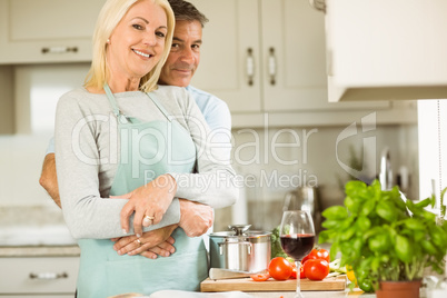 Mature couple preparing vegetarian meal together