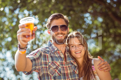 Hipster couple smiling at camera