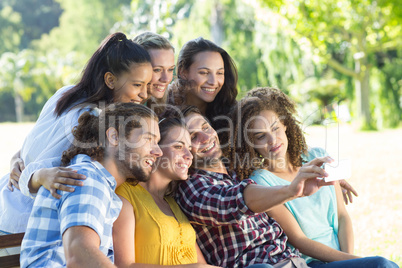 Smiling friends taking a selfie