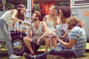 Hipster friends in camper van at festival
