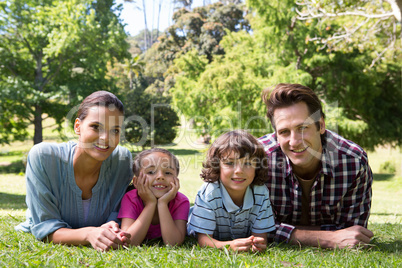 Happy family smiling at camera