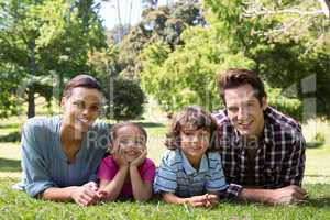 Happy family smiling at camera