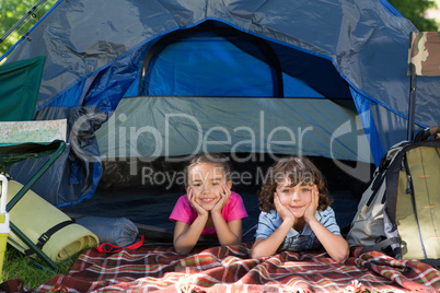 Happy siblings on a camping trip