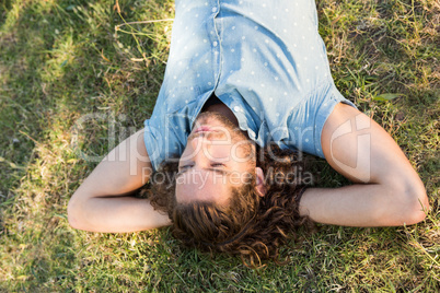 Young man lying down in the park