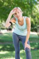 Pretty blonde jogging at the park