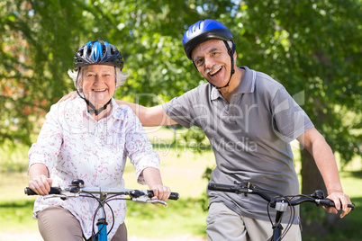 Happy senior couple on their bike