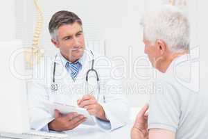 Senior patient sharing problems with doctor