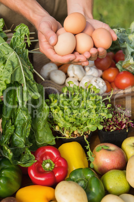 Farmer showing his organic eggs