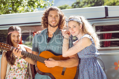 Hipster playing guitar for girls