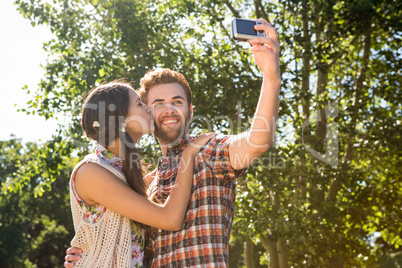 Hipster couple taking a selfie Hipster couple taking a selfie