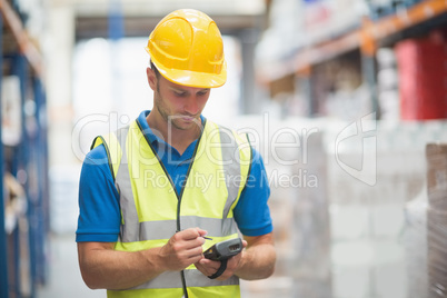 Worker using hand held computer