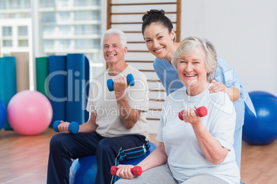 Portrait of happy instructor with senior couple